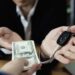 Professional car buyer in Dubai offering instant cash after inspecting a well-maintained vehicle for a fast and secure sale.