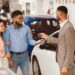 Professional car buying service in Dubai inspecting a vehicle for fast valuation and secure car selling.